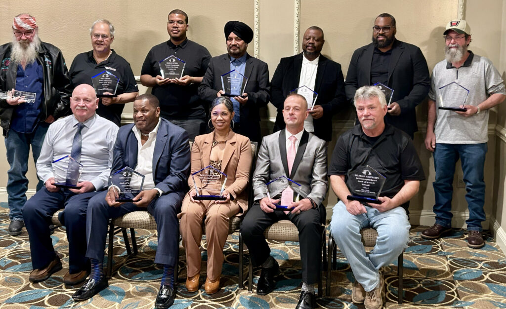 Tania Wong-Mills in group photo with all the truck drivers of the year for 2023.