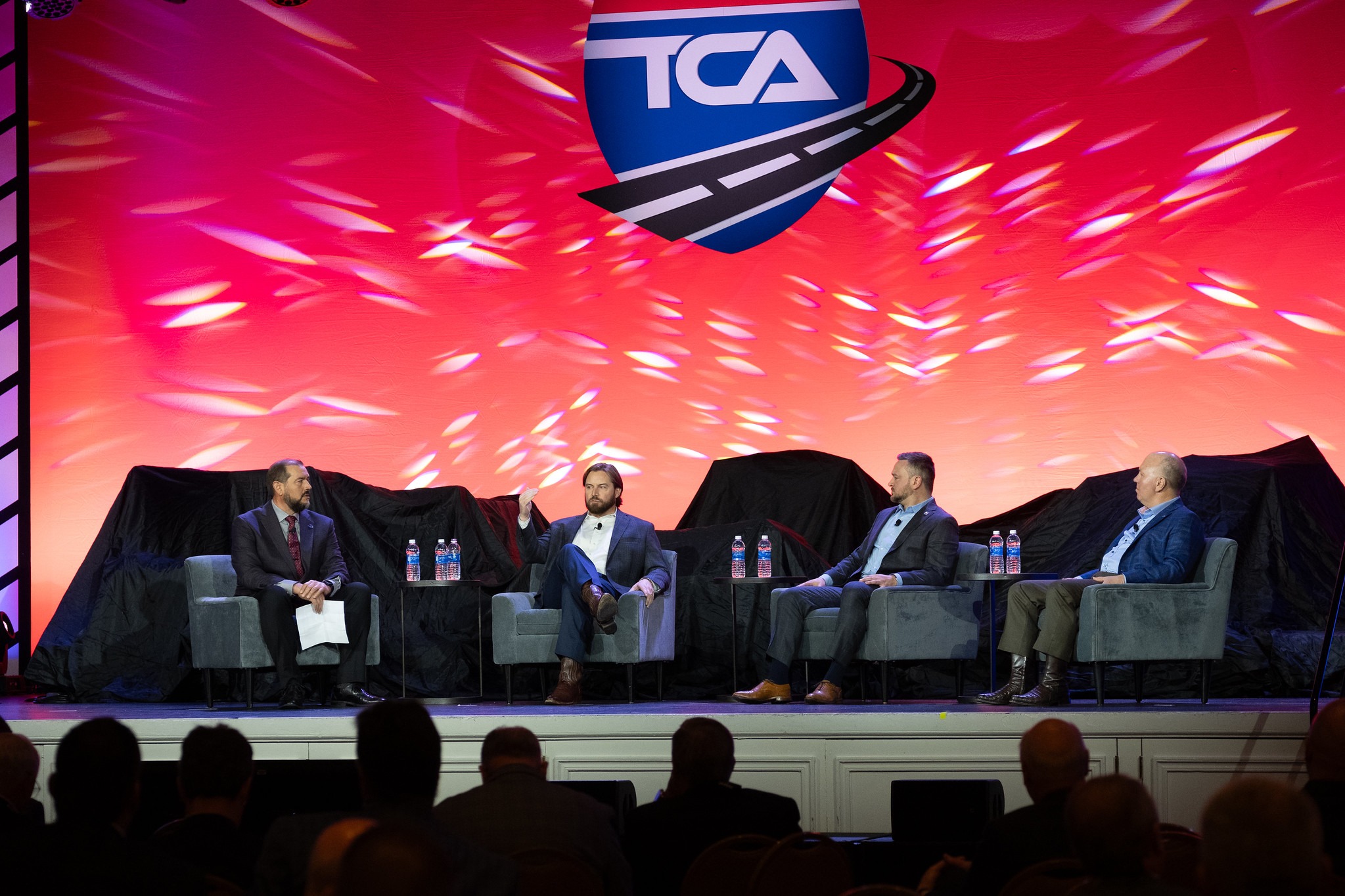 Panelists on stage at TCA conference